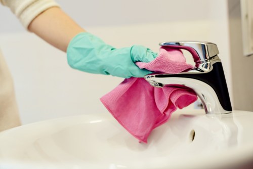 Carpet cleaning team preparing equipment safely before work