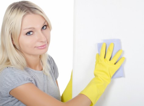 Cleaning technician checking fabric condition and stain treatment options
